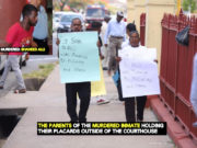 Murdered inmate’s family protest outside courthouse