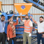 Dura Block CEO, Mr. Vinash Chand (second from right) proudly highlights GNBS Certification Sticker on his equipment.