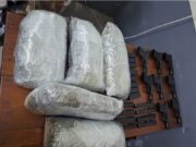 8 guns, 11.2 lbs of ganja found in barrel shipped from NY