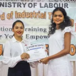 First Lady Arya Ali handing over a certificate of completion to a BIT graduate