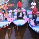 Minister of Housing and Water Collin Croal hands over the boats