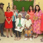 Minister of Human Services and Social Security, Dr Vindhya Persaud and members of the ministry alongside two centenarians at the launch of the Golden Generations Hubs