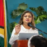 Minister of Education Priya Manickchand addressing meeting attendees