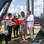 Minister of Agriculture Zulfikar Mustapha during the ceremonial cutting of the ribbon to commission the mini excavator