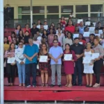 Minister in the Office of the President with responsibility for Finance and Public Service Dr Ashni Singh with the graduates