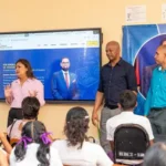 Minister of Education Priya Manickchand and staff from the Ministry of Education explain the platform