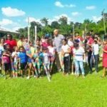 Minister of Public Works Bishop Juan Edghill shares kites to children in Linden