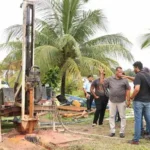 Minister of Housing and Water Collin Croal during a site visit to the well