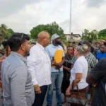 Minister Bishop Juan Edghill engages residents of East La Penitence