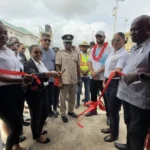 Minister of Home Affairs and Members of the Region Three Police Force cutting the ribbon for the new command centre