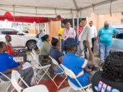 Mocha squatters celebrate relocation from road reserve to govt. allocated house lots